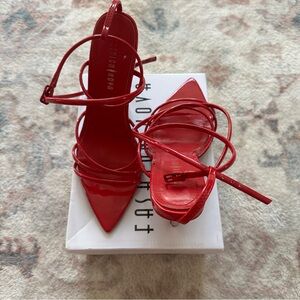 Red strappy pointed toe heels
